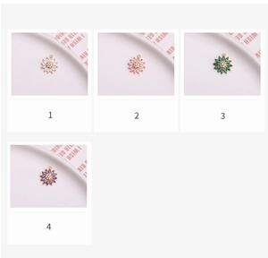 Detail of colorful daisy flower pendants with cubic zirconia and gold plating