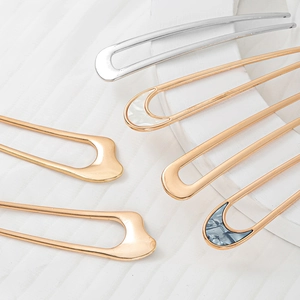 Elegant U-shaped metal hair forks in gold and silver with shell texture inlay designs