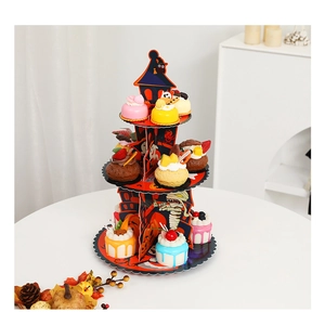 Three-tier Halloween cupcake stand featuring spooky haunted house and pumpkin patterns