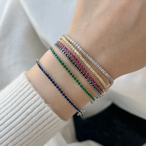 Detail of multi-color 2mm S925 silver tennis bracelets with zircon stones on wrist