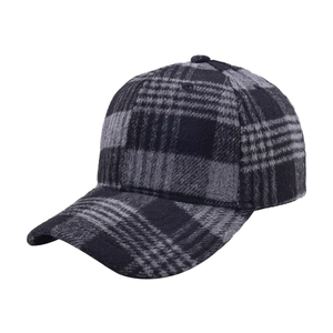 Detailed view of the gray and black plaid fabric texture on this vintage baseball cap