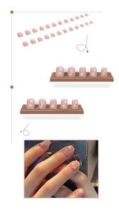 Detail of nude pink press-on nails with white stars pattern and on-hand display