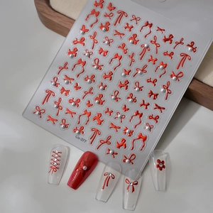 3D embossed nail stickers featuring pink ribbons and white pearls for DIY sweet manicure