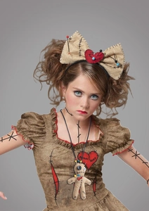 Detail view of the voodoo doll dress and bow headband for Halloween cosplay