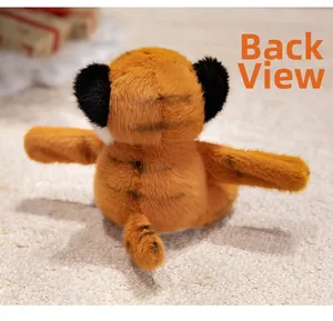 Detail view of the plush tiger wristband back showing soft orange fur and black stripes