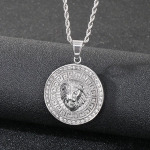 Macro view of silver lion head pendant with roman numerals and sparkling crystals