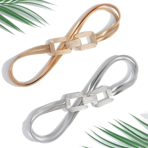 Gold and silver elastic metal waist belts with interlocking geometric buckles for dresses