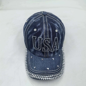 Navy blue washed denim baseball cap with USA rhinestone letters and studded brim