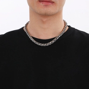 Close-up of a 10mm silver stainless steel basket weave chain necklace on a male model