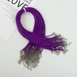 Macro detail of purple wax cord necklace chains with silver lobster clasps and extenders