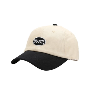 Classic two-tone baseball cap in cream and black featuring embroidered DUNK patch