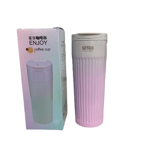 Pink gradient insulated stainless steel coffee cup with textured surface and gift box