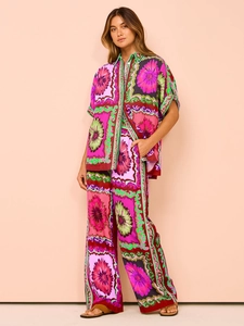 Close-up of silk-like floral print fabric and elastic waist detail on summer lounge set