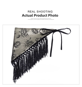 Detail of silver silk scarf with black rose patterns and elegant long fringe trim