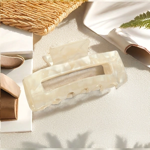 Rectangular marble texture hair claw clip in creamy white for elegant hair styling
