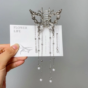 Silver butterfly hair claw with hanging tassels and elegant pearl drop accents