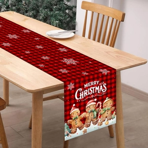 Red and black buffalo plaid Christmas table runner with gingerbread man and snowflake patterns
