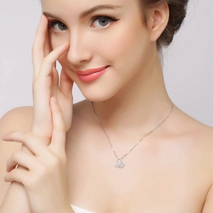 Elegant S925 silver moon and heart pendant necklace with shimmering crystals on a woman