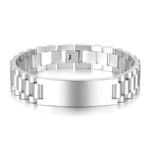 Macro view of silver stainless steel watch-style bracelet with polished nameplate