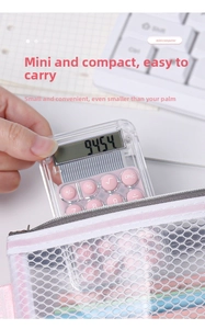 Mini transparent pink calculator being placed into a mesh stationery organizer bag