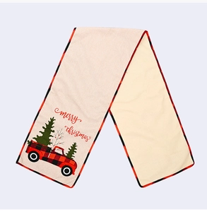 Detail of Christmas table runner with red plaid truck, Xmas tree and Merry Christmas print