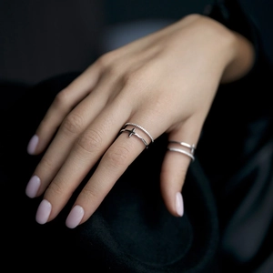 Detail view of 925 sterling silver cross ring set with sparkling zirconia on hand
