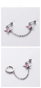 Detail of titanium steel wing heart earrings with pink zircon and punk style chains