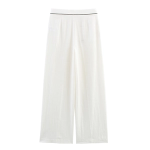 Detailed macro view of white textured wide-leg trousers with black piping waist detail