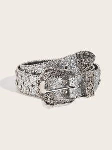 Detail of silver western belt featuring rhinestone studs and engraved metal buckle