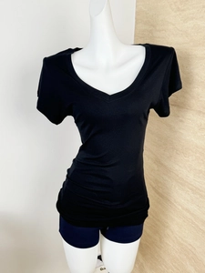 Detailed view of black V-neck t-shirt made of Tencel wool blend with a slim fit design