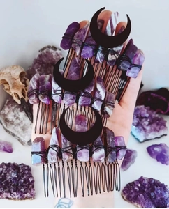 Close-up of handmade black moon hair comb set with natural purple amethyst stones