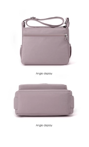 Detail views of purple waterproof nylon crossbody bag showing front and bottom angles