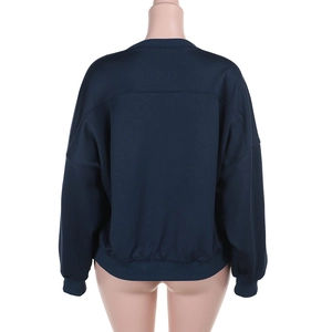 Detail view showing the back side of a navy blue long sleeve crewneck sweatshirt for women
