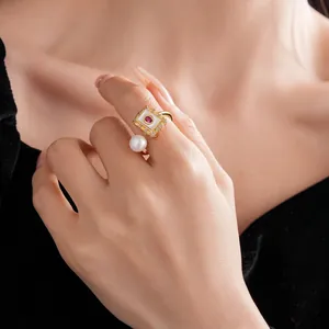 Gold plated open ring with square pearl detail and red stone in retro French style
