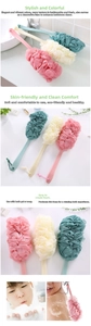 Detail of pink, yellow, and teal long handle bath brushes with soft mesh sponges