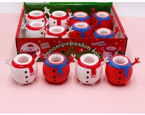 Macro detail of Santa Claus and Snowman squeeze toys showing soft texture and colors