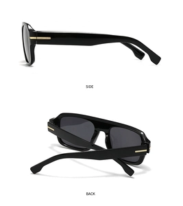 Detail view of black square sunglasses with signature horizontal gold metal temple accents