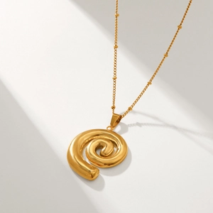 Polished 18k gold stainless steel spiral shell pendant necklace with a minimalist bead chain