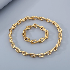 Golden vintage nail chain jewelry set with industrial style necklace and bracelet