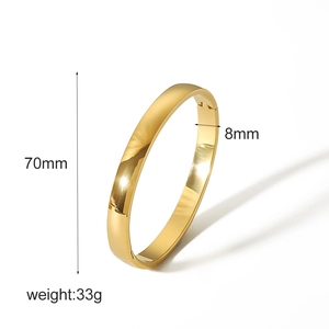 Detailed view of polished 18k gold plated bangle with 70mm diameter and 8mm width measurements