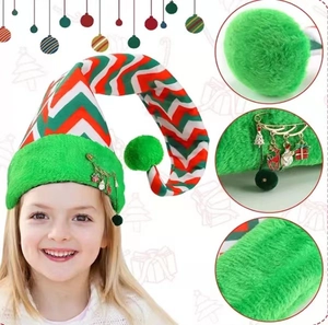 Detail of Christmas elf hat featuring striped fabric and metal holiday charms on the brim