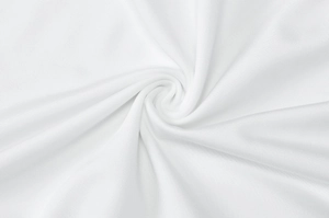 Macro shot of soft white fabric texture with elegant spiral pleats and woven details
