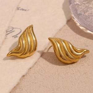 Macro detail of gold-plated 18K stainless steel liquid water drop stud earrings
