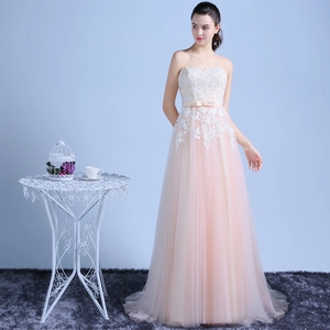 Elegant strapless lace evening gown with champagne bow and layered pink tulle skirt