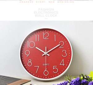 Close-up of deep red matte dial with white 3D numbers and quartz silent movement