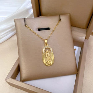 Gold-plated Virgin Mary medallion necklace with sparkling cubic zirconia on white silk