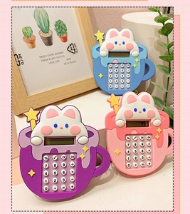 Close-up of rabbit calculator keychains in blue, purple and pink with silicone material