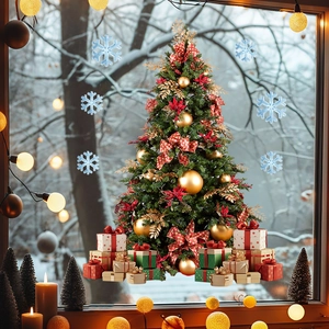Close-up of festive Christmas tree and snowflake window decals with winter landscape view
