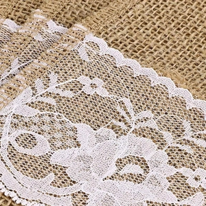 Rustic burlap and white floral lace silverware holder for festive holiday table settings