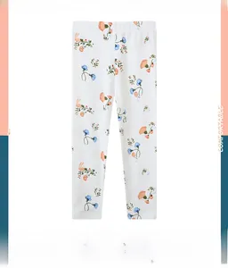 Detail of floral and pink rabbit patterns on white girls' leggings for autumn sets